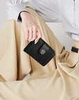 Victoria Hyde Rosi black genuine leather wallet, multifunctional design with 19 card slots, side bill compartment, and zippered coin pocket.