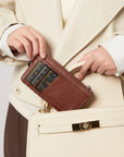 Victoria Hyde caramel genuine leather card holder, unisex & multifunctional. Features 10 card slots, 1 ticket slot, zippered coin pocket, and detachable side closure.