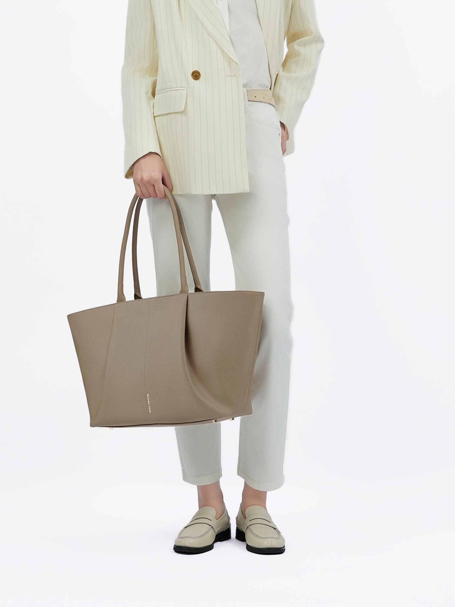 Victoria Hyde Ada Beige new work bag – understated elegance, fits 16" laptop, vegan microfiber leather, water-repellent, perfect for commuters.