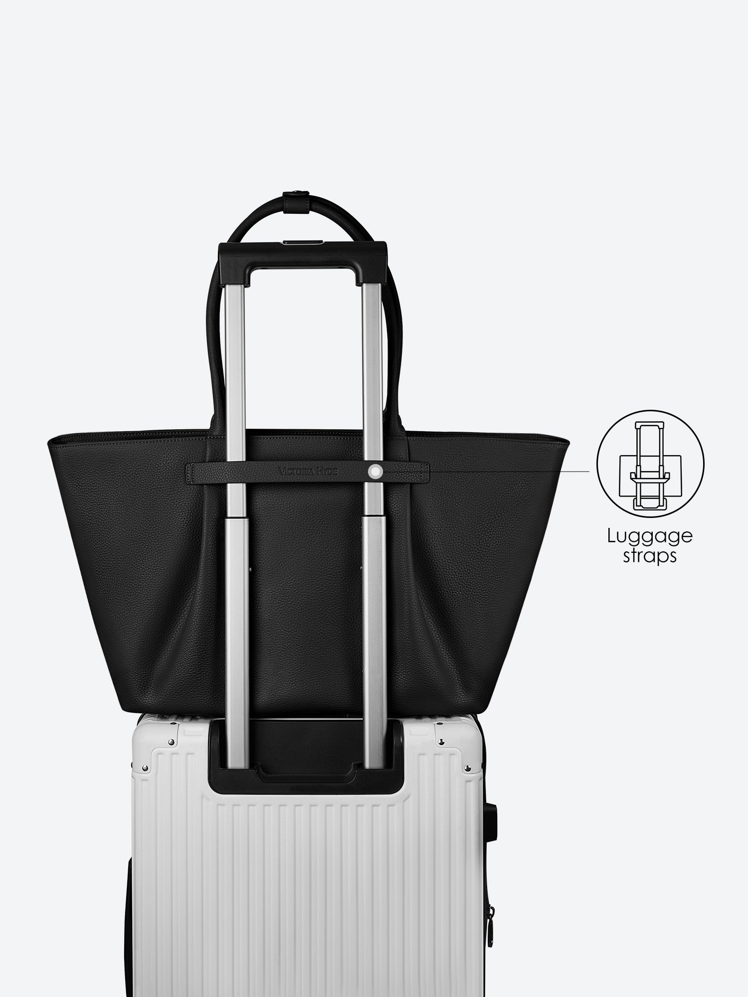 Victoria Hyde Ada black laptop bag with luggage strap, easily attaches to trolley handles for convenient travel, stylish business bag for commuters.