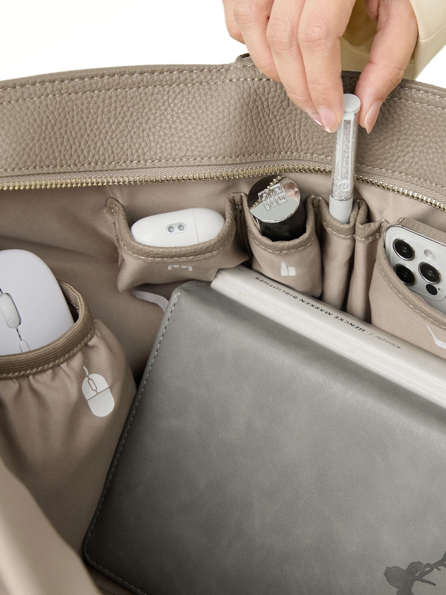 Victoria Hyde Ada beige laptop bag interior showing organized pockets for smartphone, pens, and accessories, perfect for daily business essentials.