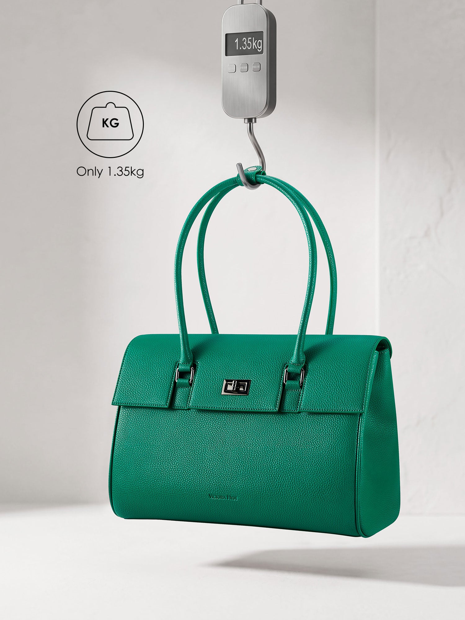 Victoria Hyde Jolene green laptop bag showing lightweight design, weighing only 1.35kg, stylish vegan leather business bag for 15-inch laptops.