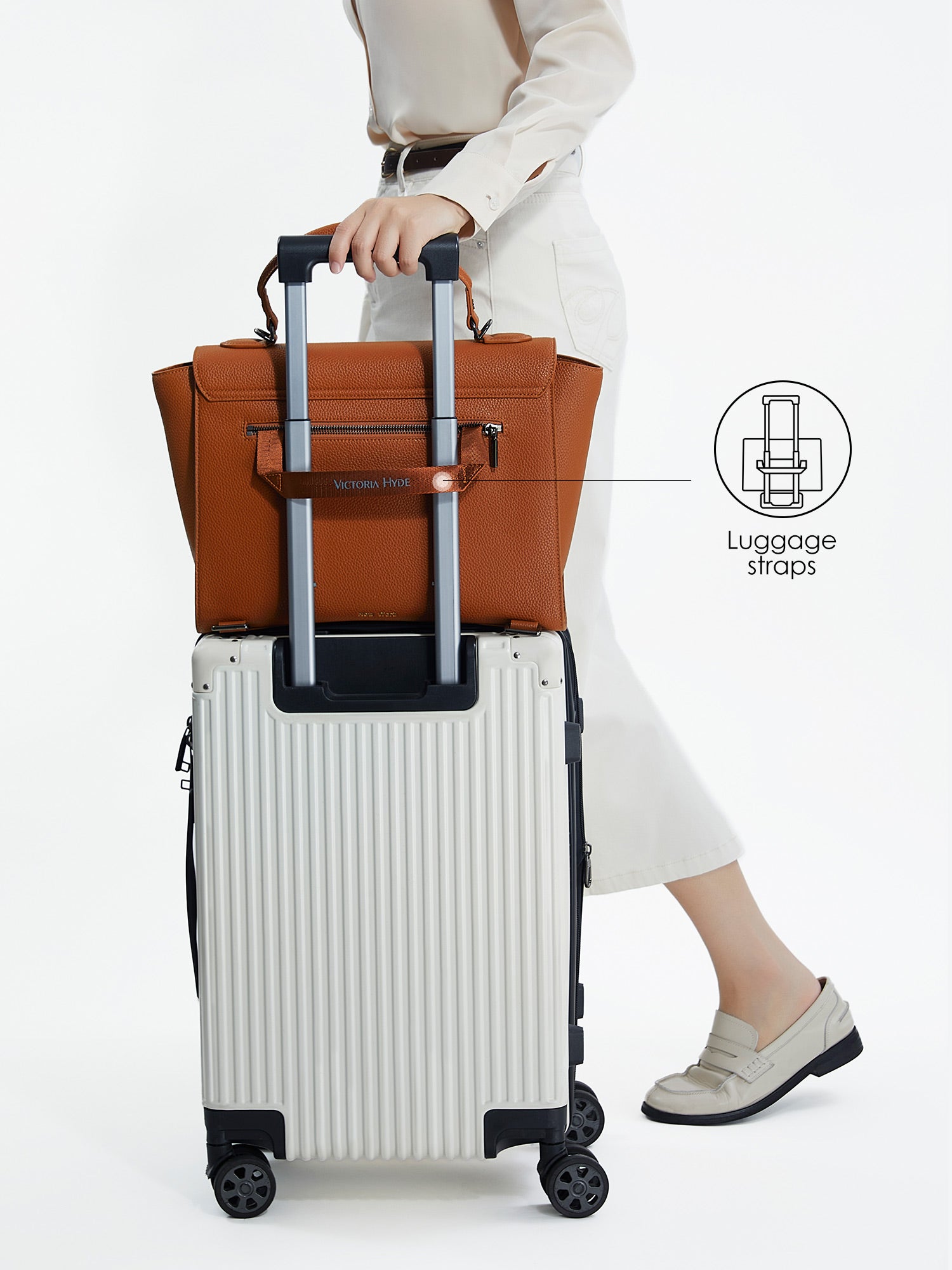 Victoria Hyde Potter brown laptop bag with luggage strap, easily attaches to trolley handles for convenient travel, stylish business bag for commuters.
