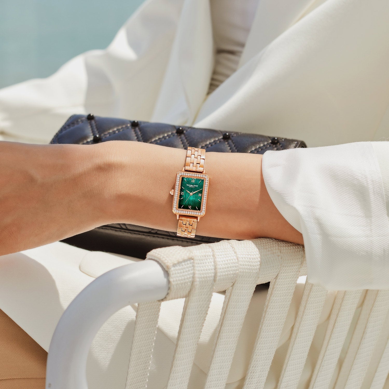 Victoria Hyde Westminster women's watch in rose gold with green dial, square case, stainless steel bracelet, classic elegant design.