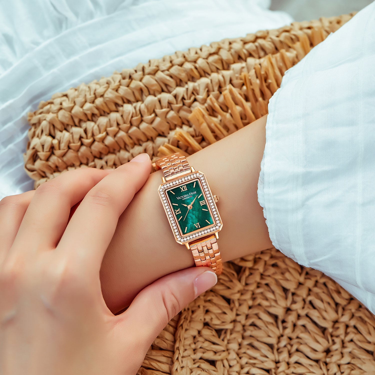 Victoria Hyde Westminster women's watch in rose gold with green dial, square case, stainless steel bracelet, classic elegant design.