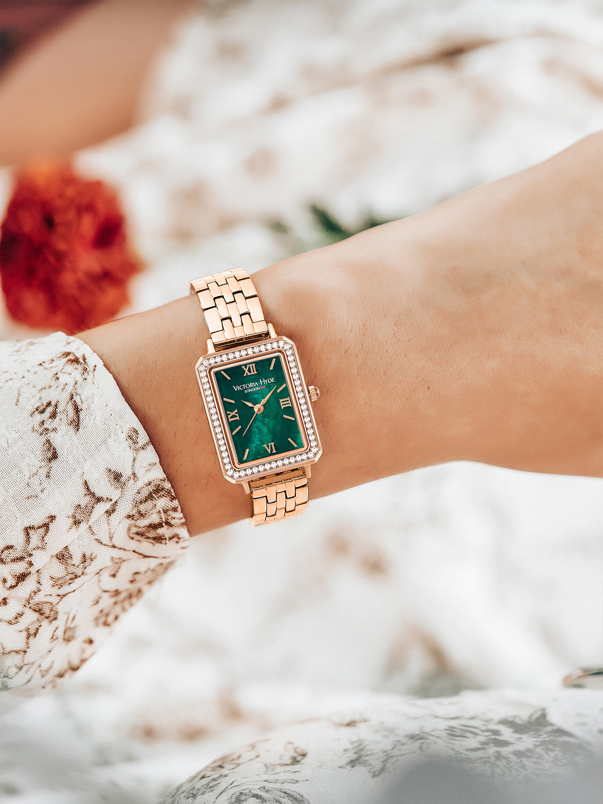 Victoria Hyde Westminster women's watch in rose gold with green dial, square case, stainless steel bracelet, classic elegant design.
