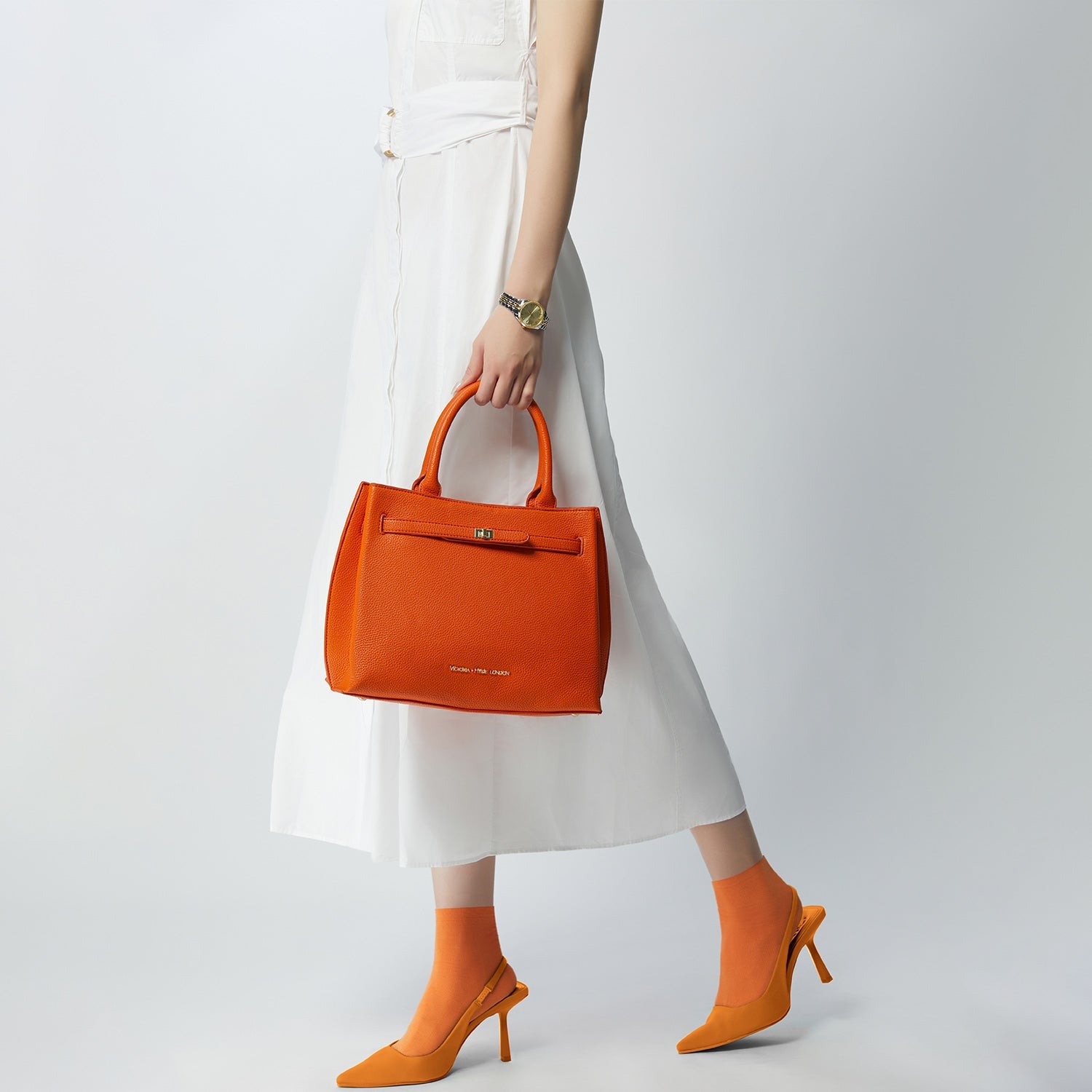 Victoria Hyde Lambeth elegant work handbag with gold accents, convertible shoulder bag, sustainable faux leather, perfect for executives.