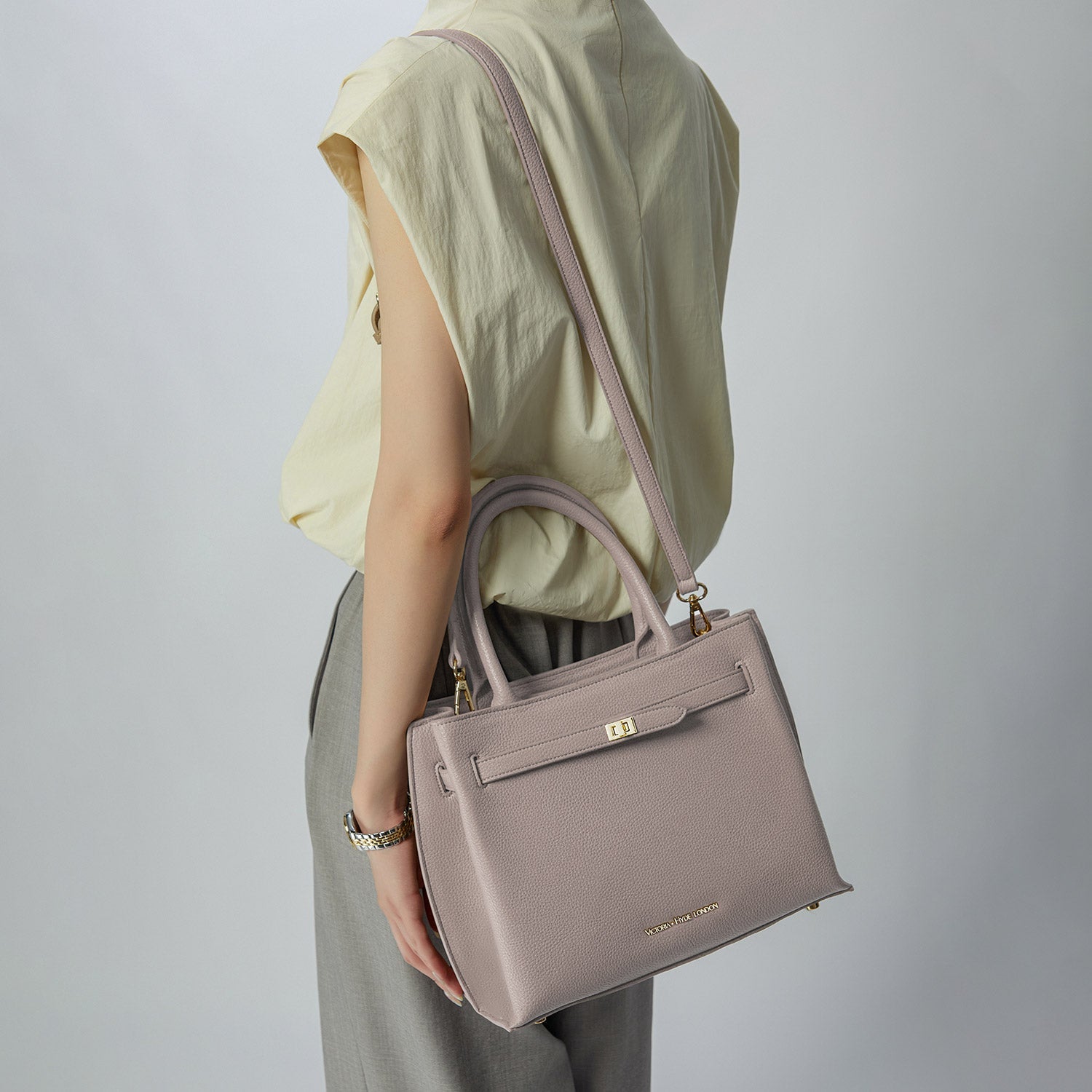 Victoria Hyde Lambeth elegant faux leather shoulder bag with gold accents, sustainable, structured interior, perfect work handbag for women.