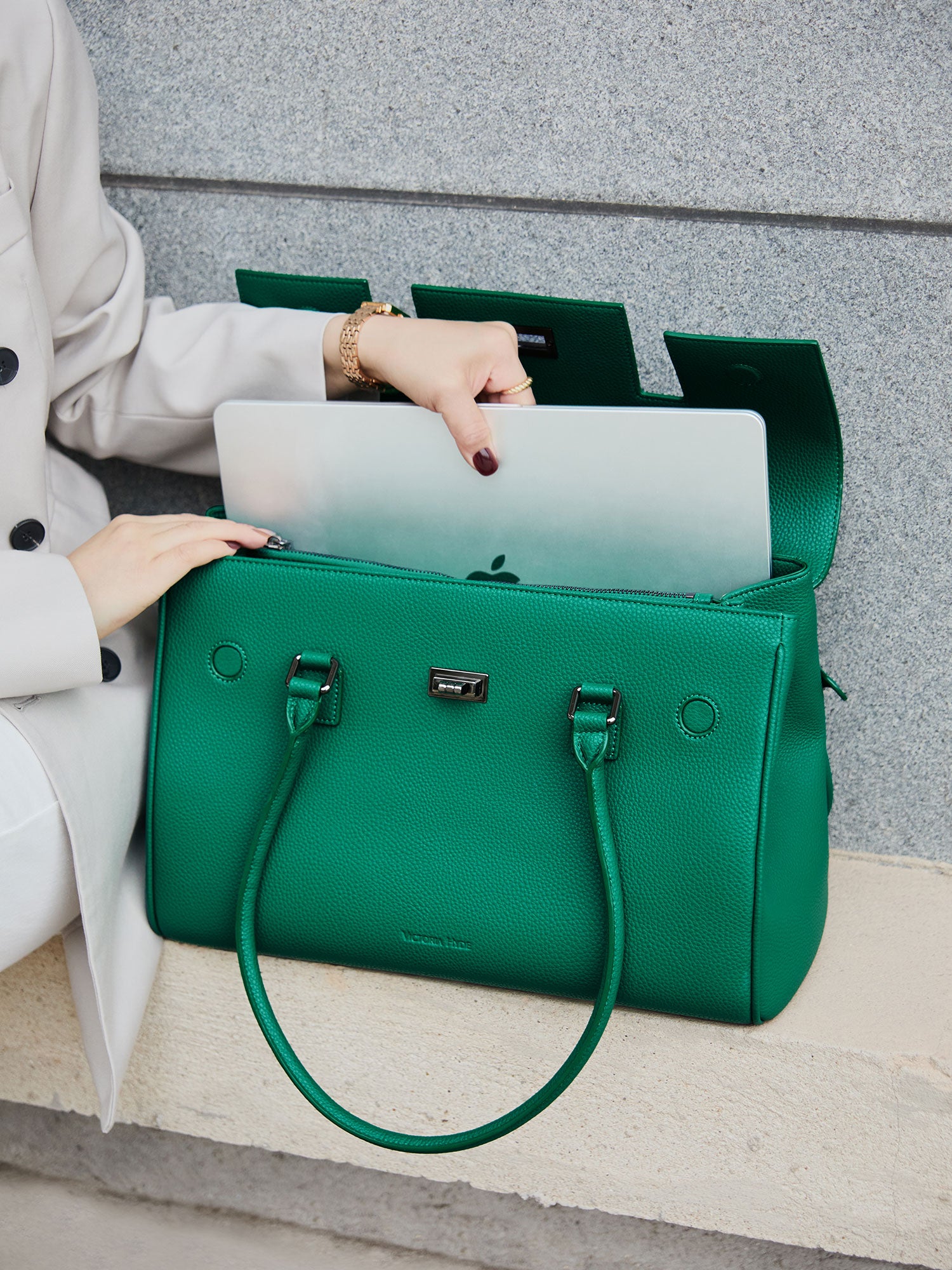 Green Victoria Hyde Jolene large work bag with padded laptop compartment, smart interior, removable cosmetic pouch, vegan, water-repellent, perfect for working mothers.