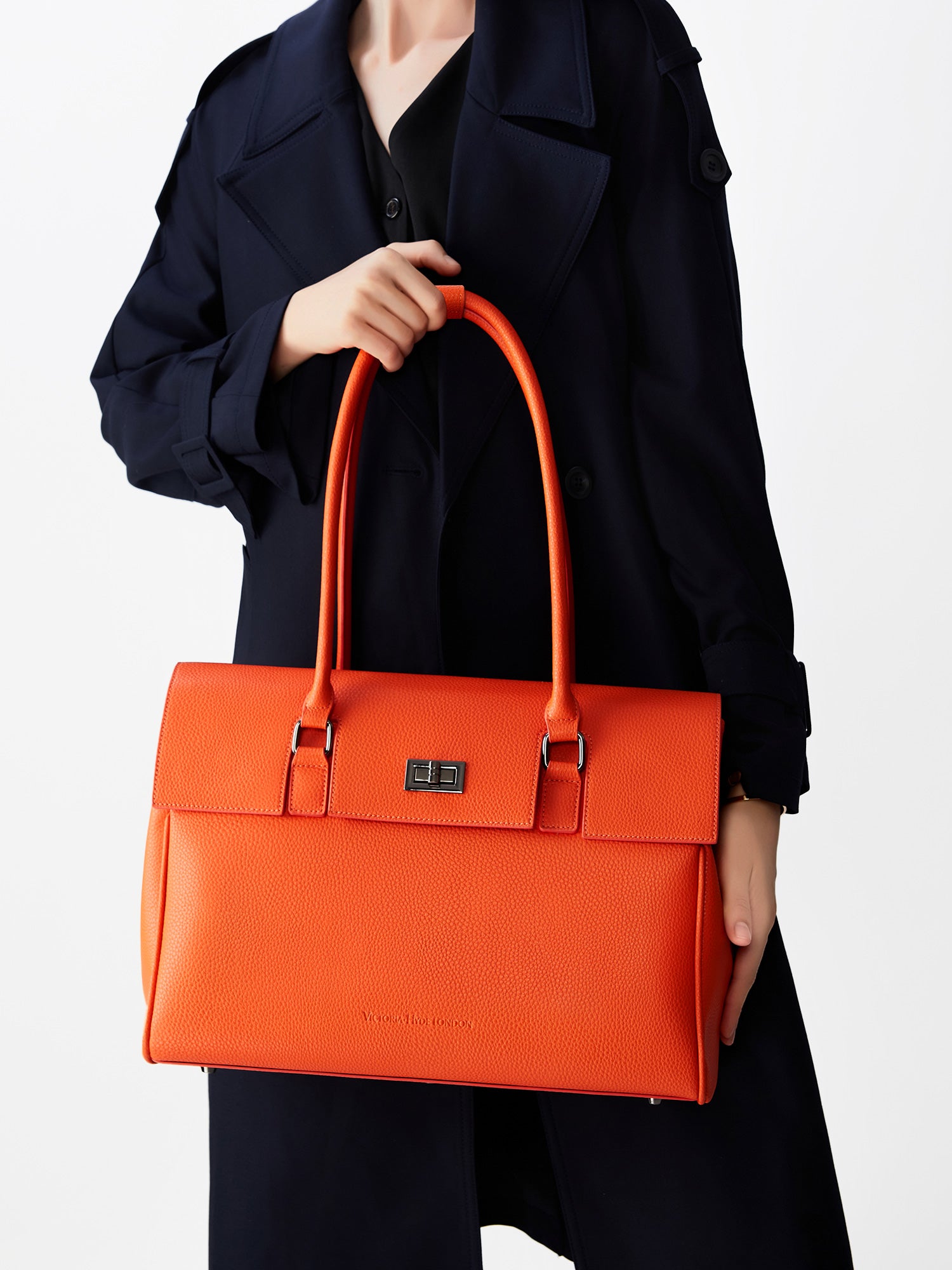 Victoria Hyde Jolene large orange work bag with 15" laptop compartment, removable cosmetic pouch, vegan, water-repellent, smart organization.
