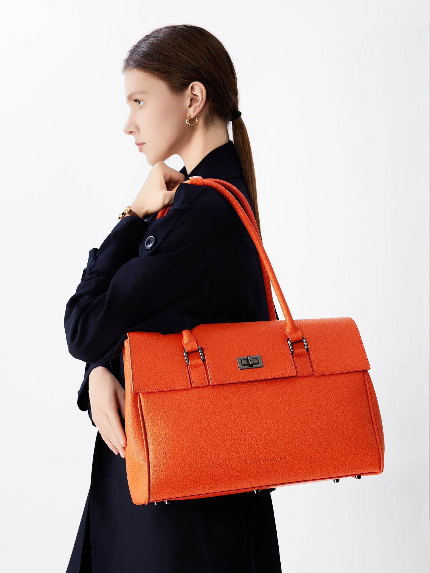 Victoria Hyde Jolene large orange work bag with 15" laptop compartment, removable cosmetic pouch, vegan, water-repellent, smart organization.