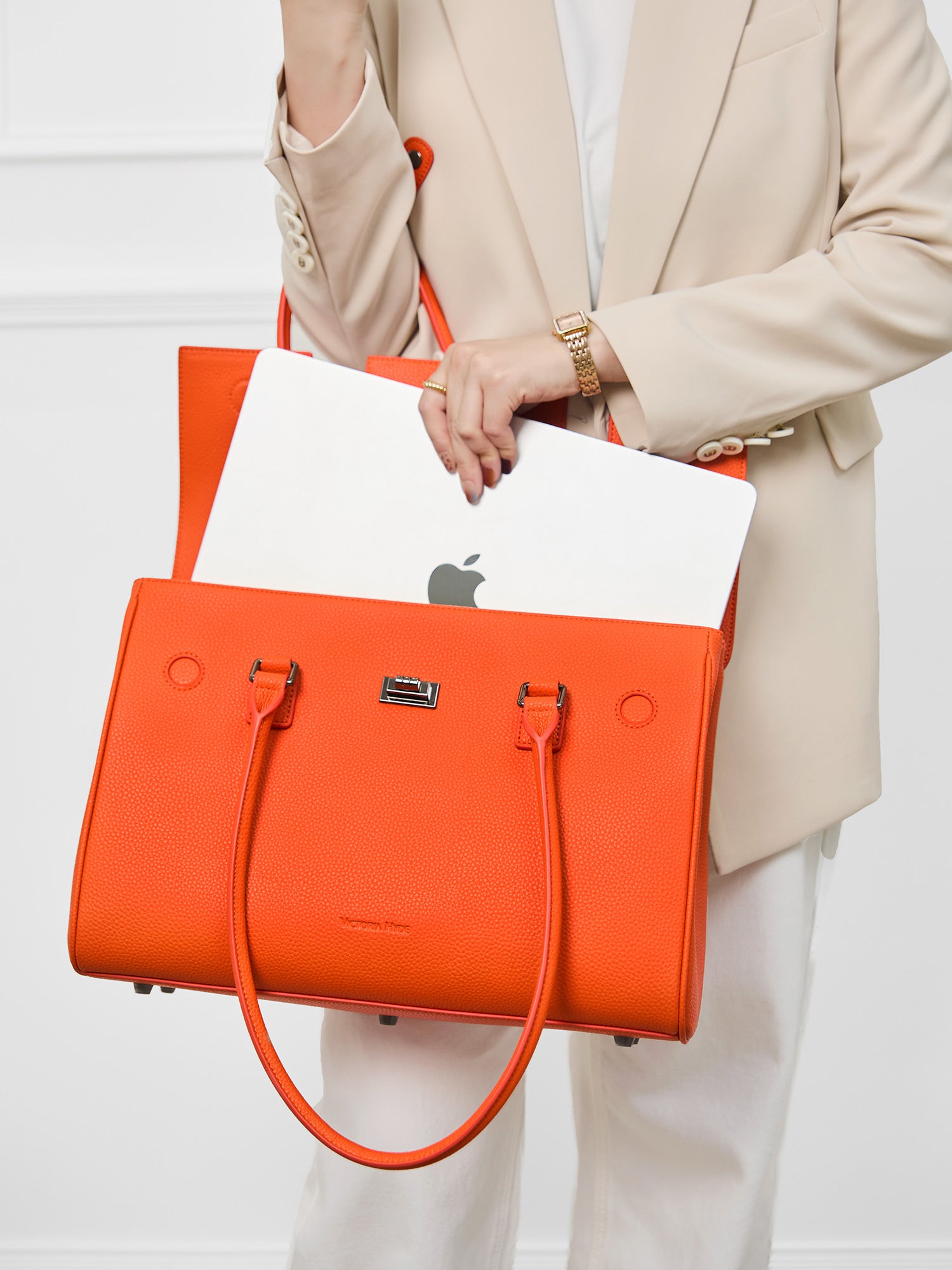 Victoria Hyde Jolene large orange work bag with 15" laptop compartment, removable cosmetic pouch, vegan, water-repellent, smart organization.