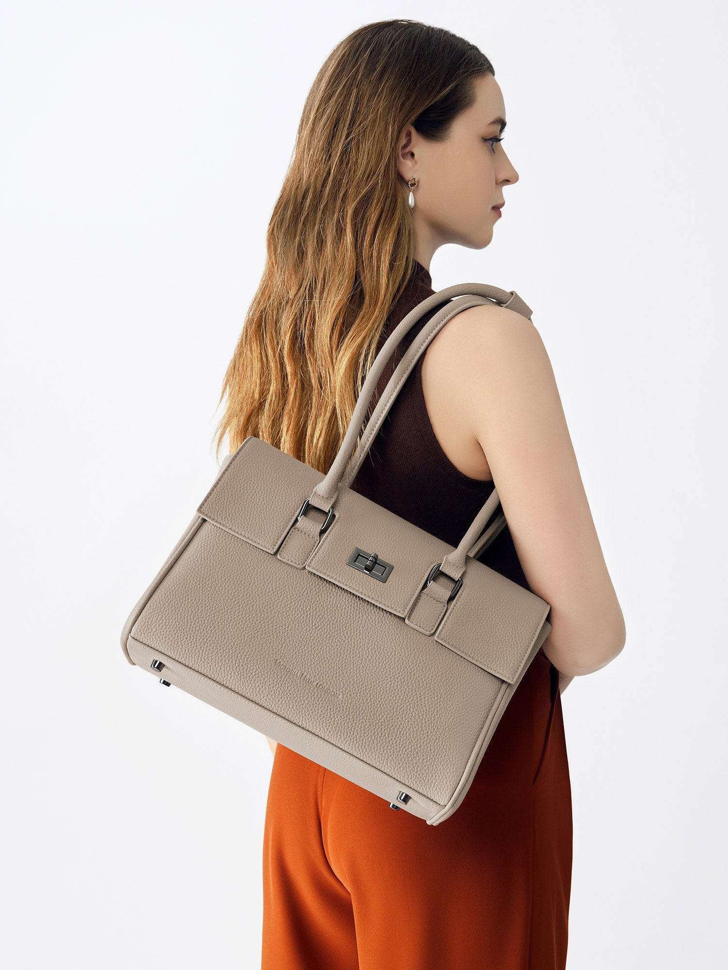 Victoria Hyde Jolene Small Beige work bag – fits 15" laptop, vegan leather, water-repellent, hidden luggage strap, perfect for working mothers.