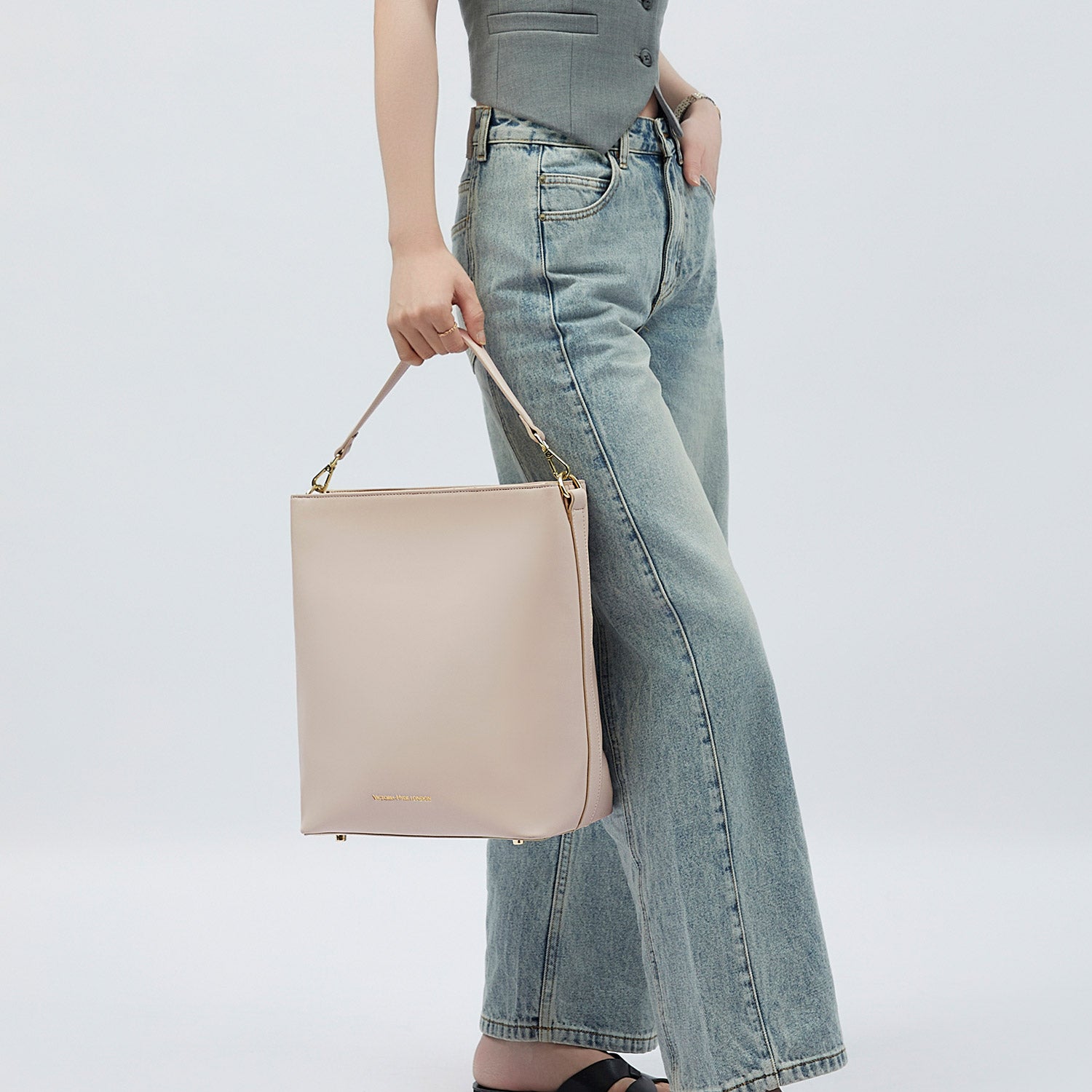 Victoria Hyde Kloey Large work bag in Moon White. Minimalist vegan leather tote with laptop compartment, water-repellent, scratch-resistant. Perfect for professional women.