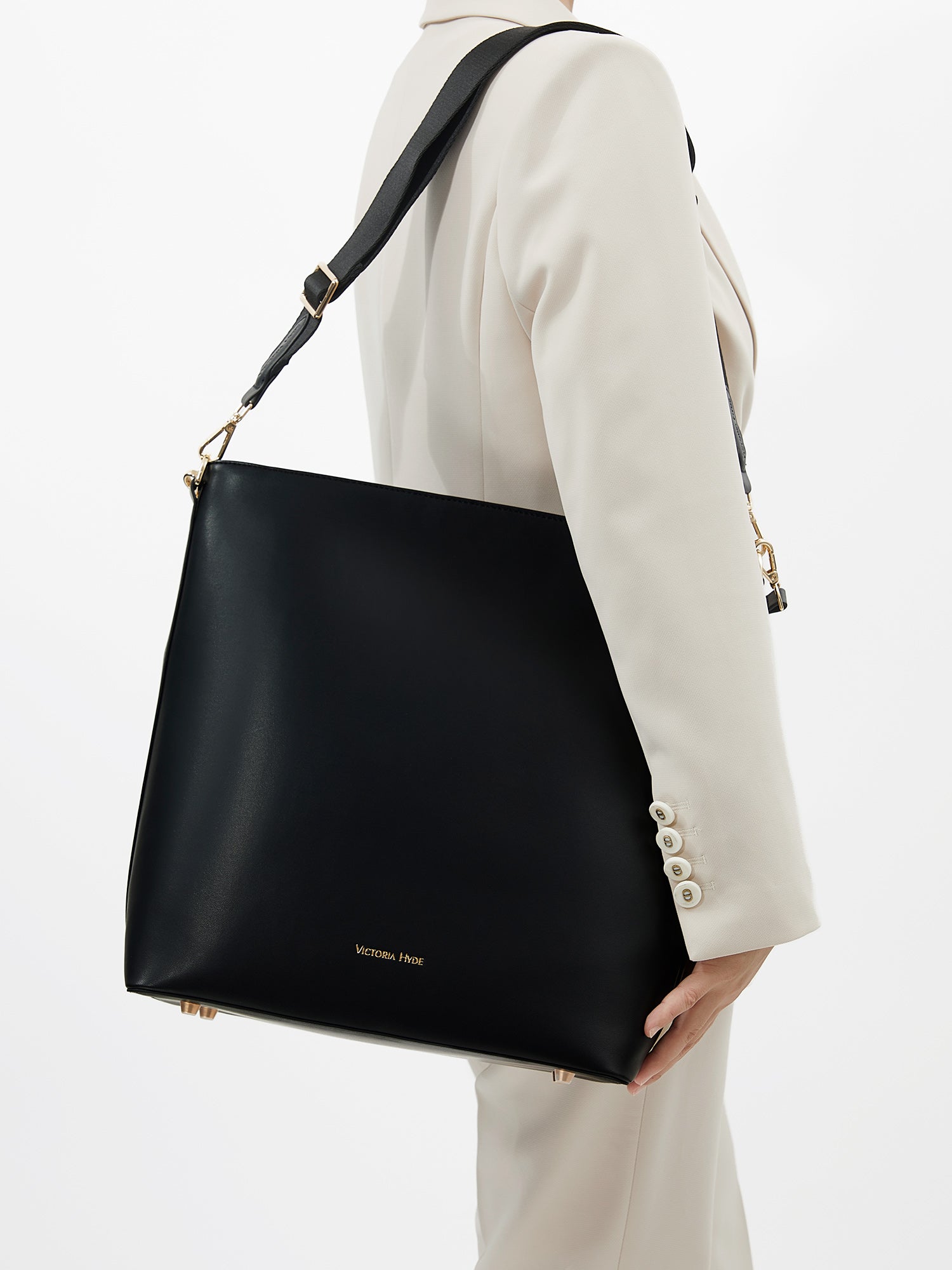 Minimalist black work bag Kloey Large by Victoria Hyde. Vegan, water-repellent, fits 13" laptop. Elegant daily essential for power women.