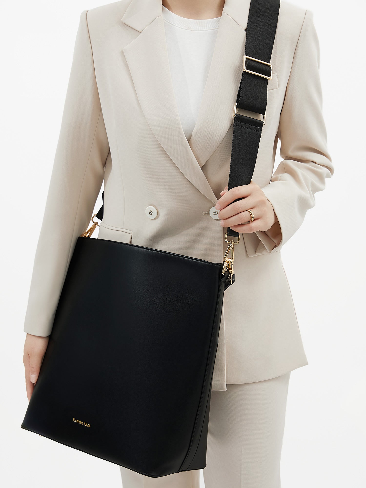 Minimalist black work bag Kloey Large by Victoria Hyde. Vegan, water-repellent, fits 13" laptop. Elegant daily essential for power women.