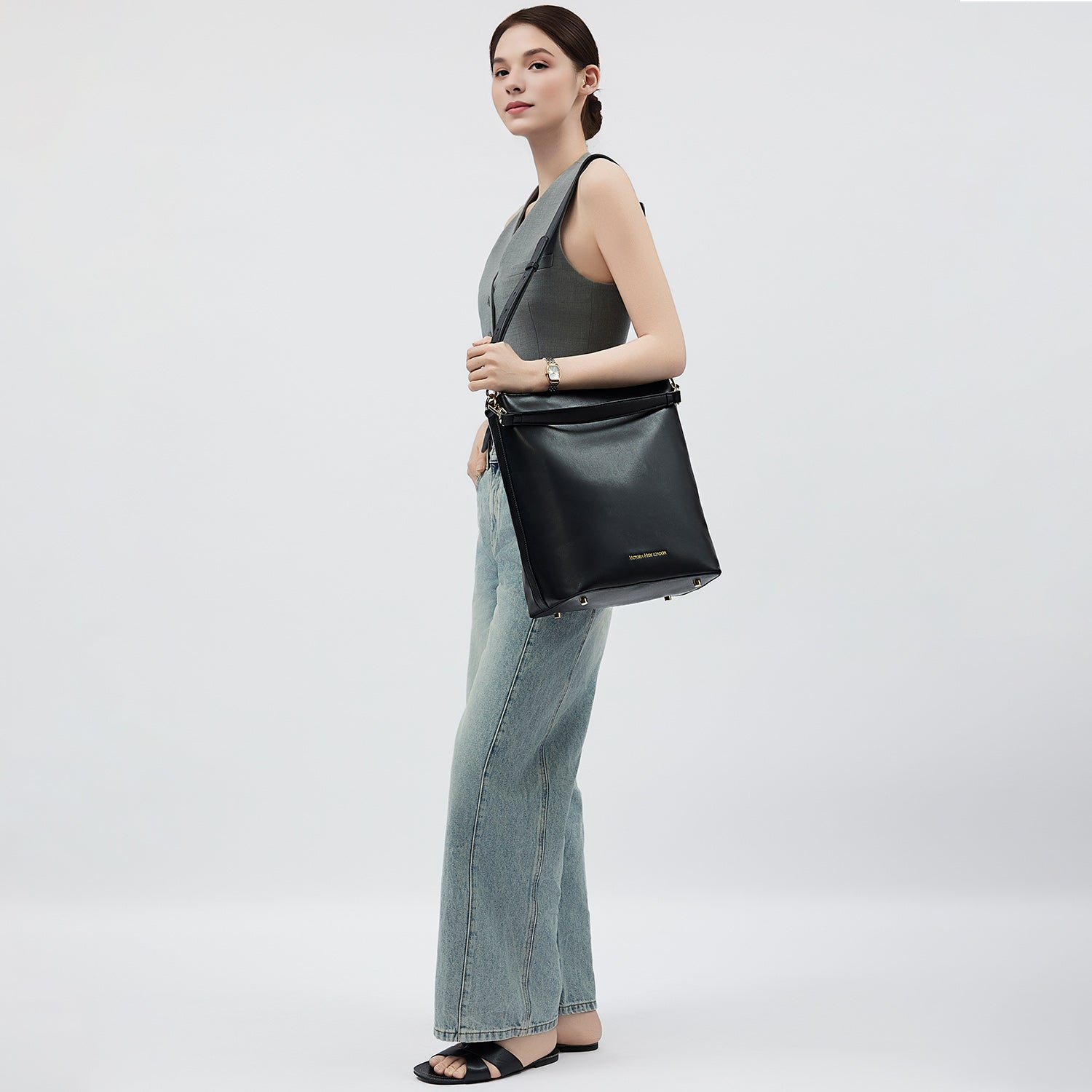 Minimalist black work bag Kloey Large by Victoria Hyde. Vegan, water-repellent, fits 13" laptop. Elegant daily essential for power women.