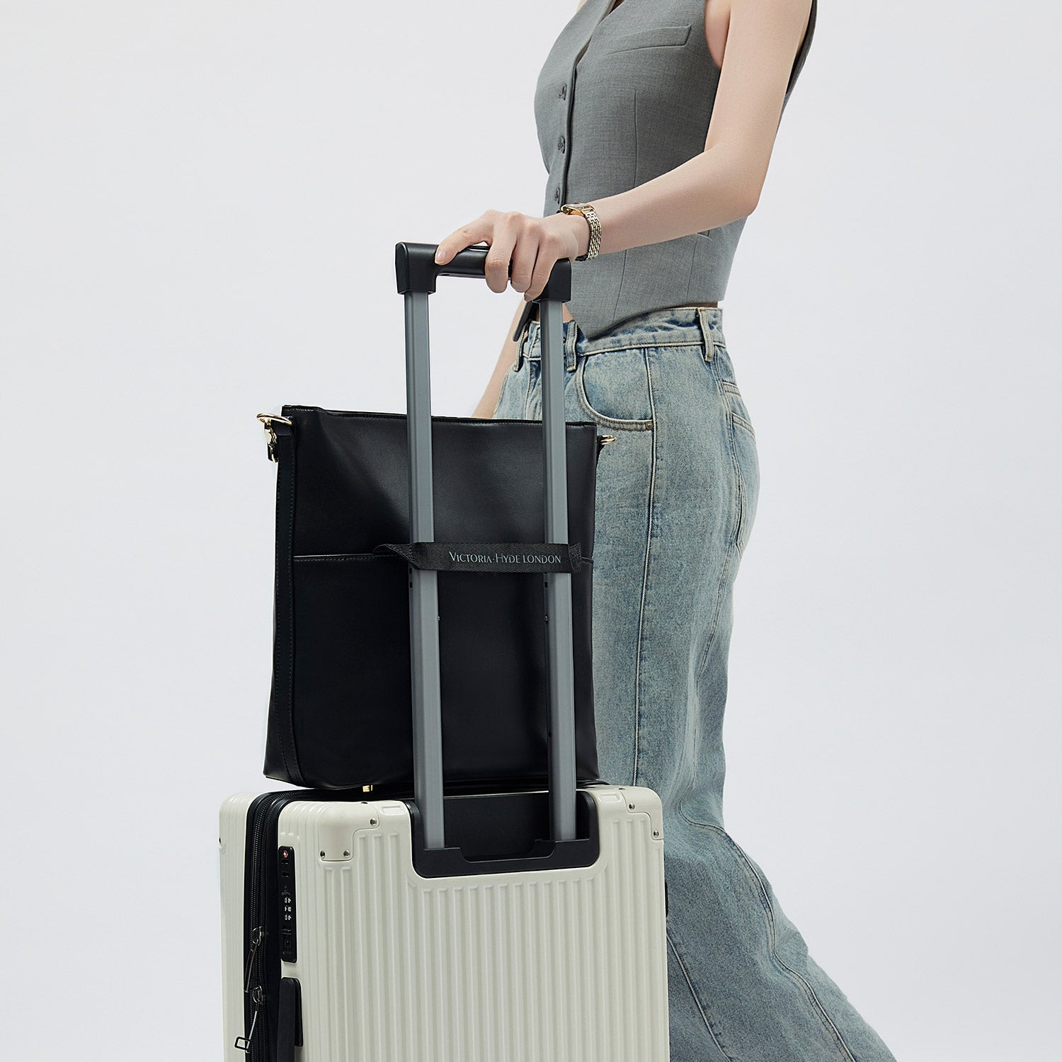 Minimalist black work bag Kloey Large by Victoria Hyde. Vegan, water-repellent, fits 13" laptop. Elegant daily essential for power women.