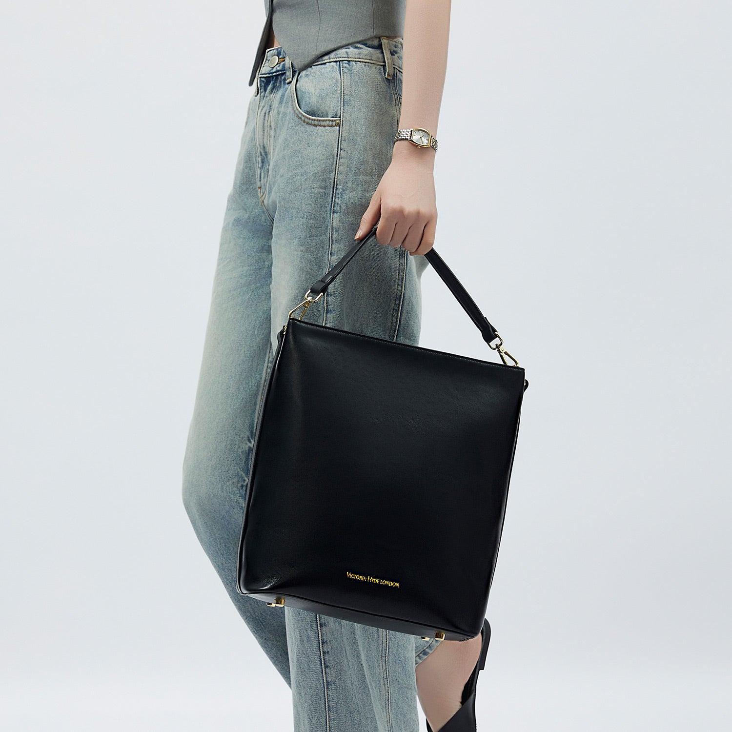 Minimalist black work bag Kloey Large by Victoria Hyde. Vegan, water-repellent, fits 13" laptop. Elegant daily essential for power women.