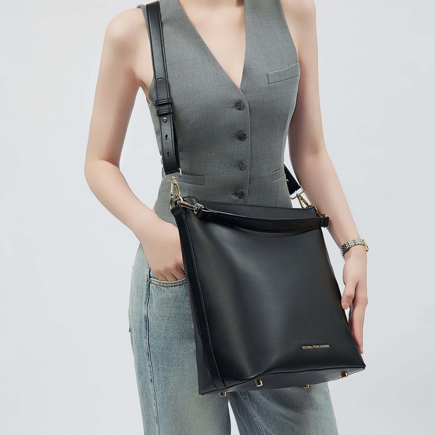 Minimalist black work bag Kloey Large by Victoria Hyde. Vegan, water-repellent, fits 13" laptop. Elegant daily essential for power women.