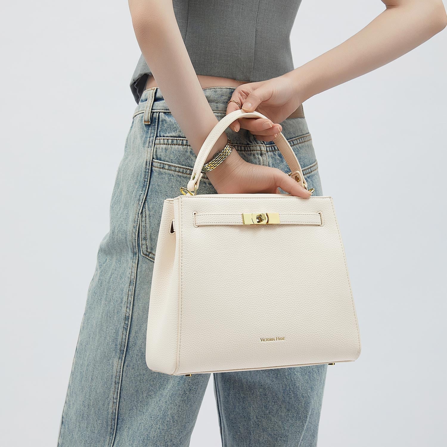 Victoria Hyde Victoria III crossbody work bag in PU leather with gold hardware, fits 12.9" tablet, organized interior for professional women.
