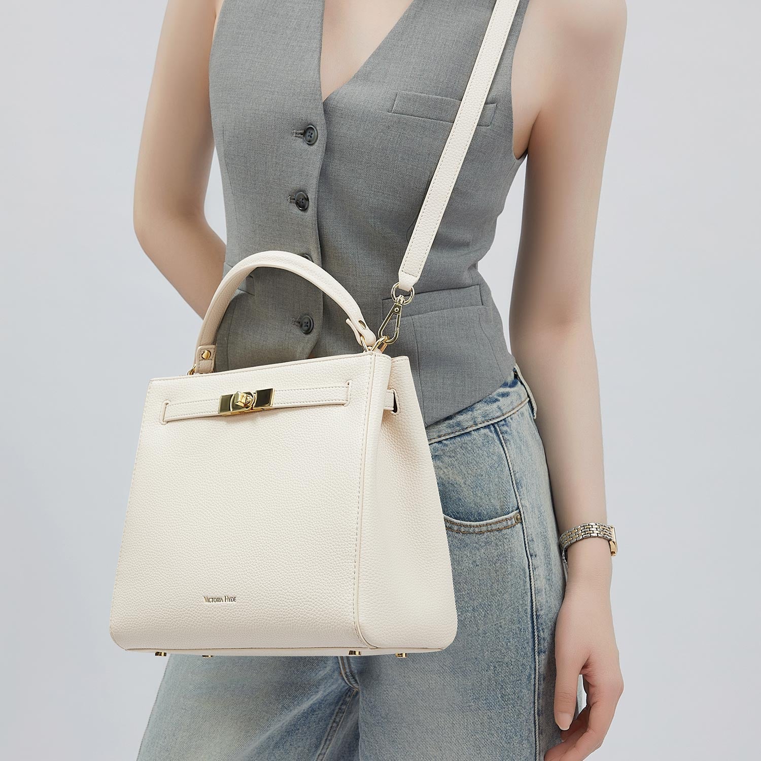 Victoria Hyde Victoria III crossbody work bag in PU leather with gold hardware, fits 12.9" tablet, organized interior for professional women.