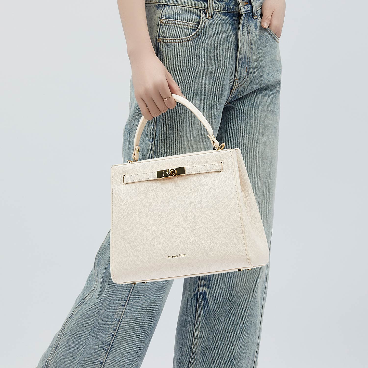 Victoria Hyde Victoria III crossbody work bag in PU leather with gold hardware, fits 12.9" tablet, organized interior for professional women.