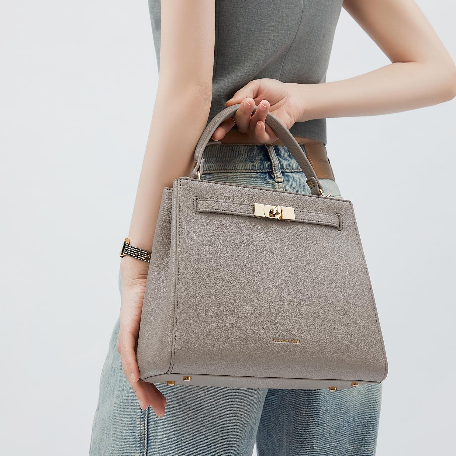 Victoria Hyde Victoria III crossbody work bag in PU leather with gold hardware, fits 12.9" tablet, organized interior for professional women.