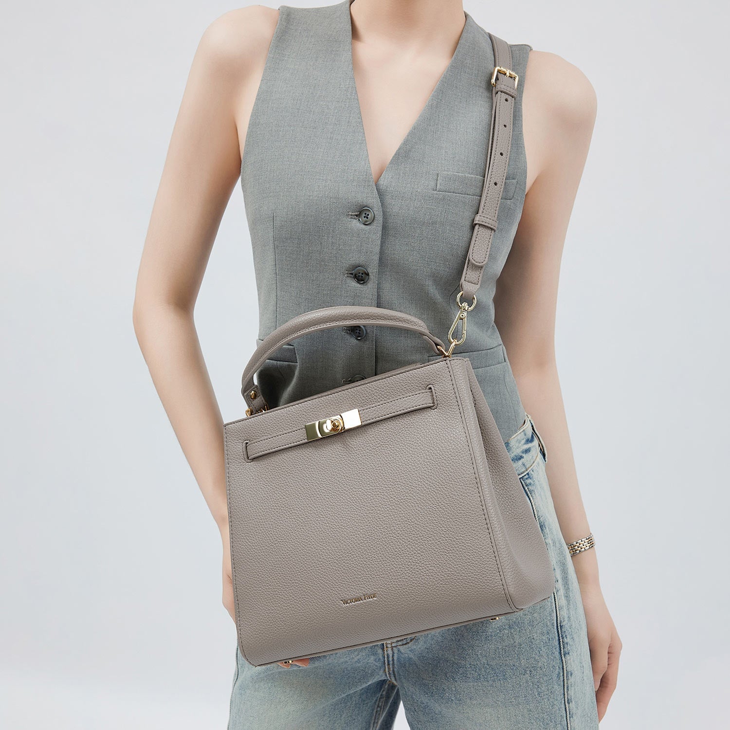 Victoria Hyde Victoria III crossbody work bag in PU leather with gold hardware, fits 12.9" tablet, organized interior for professional women.