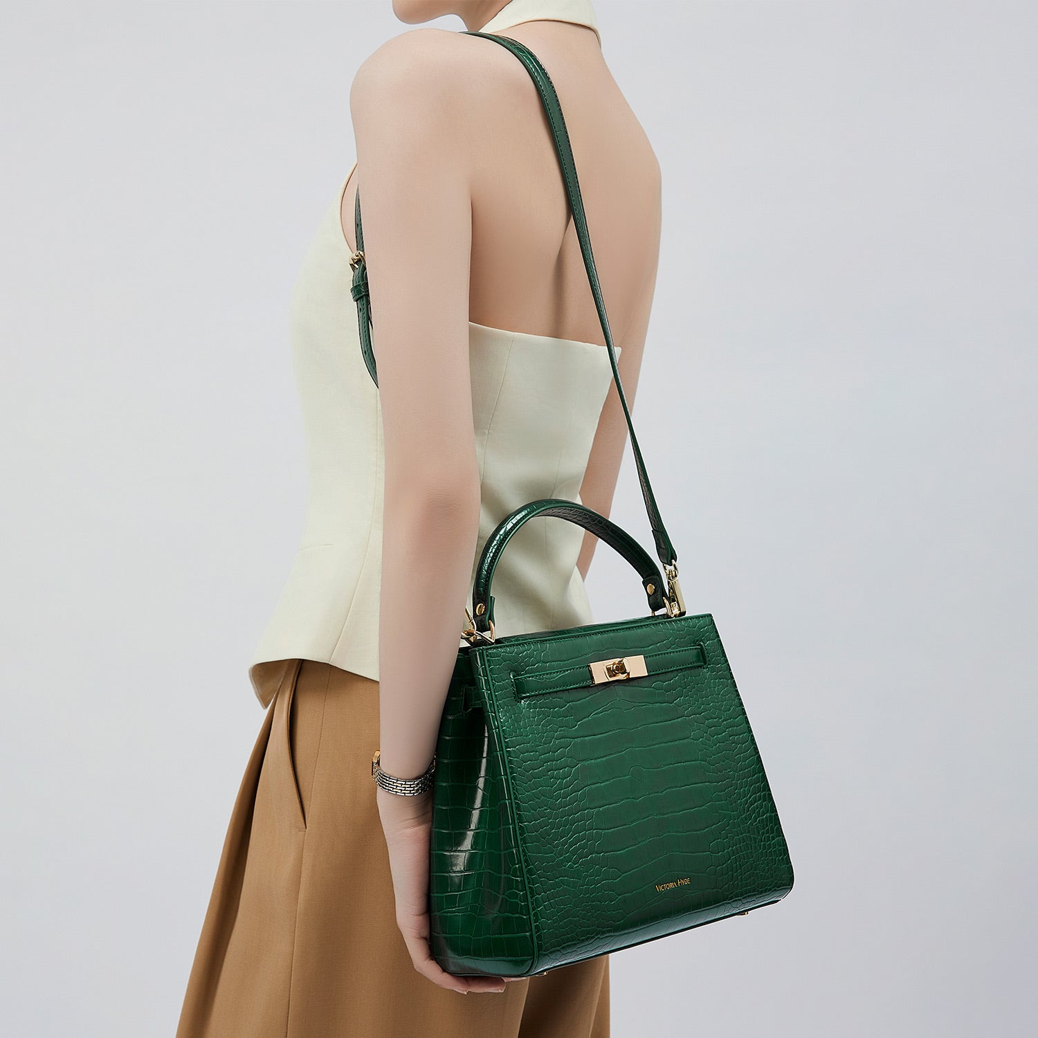 Victoria Hyde Victoria III women's crossbody work bag, trapezoidal synthetic leather, gold clasp, laptop-friendly, organized compartments, ideal for commuting.