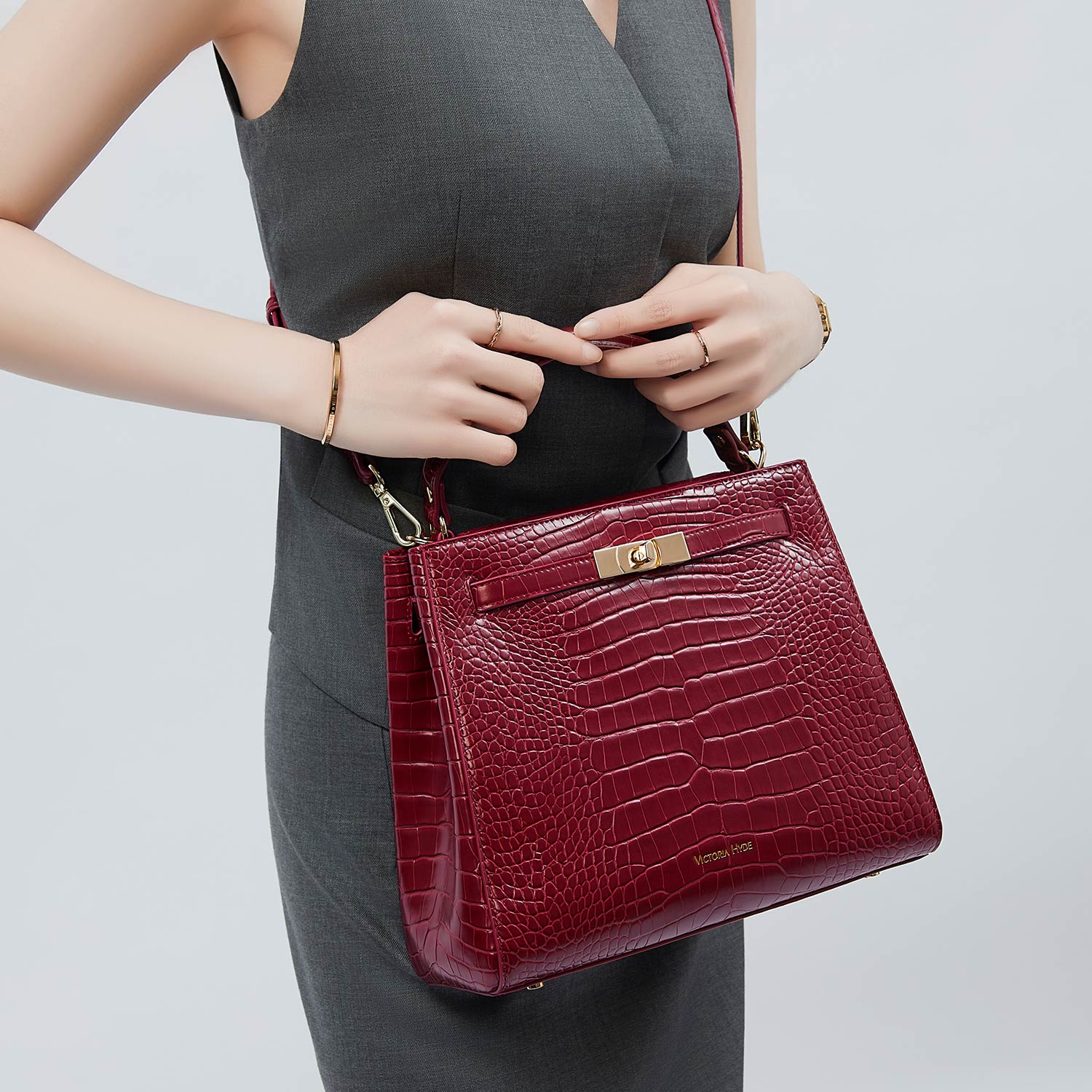 Victoria Hyde Victoria III crossbody work bag: trapezoidal PU leather, gold hardware, fits 12.9" tablet, multiple pockets. Ideal for commuting women.