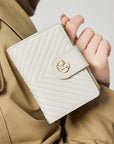 Victoria Hyde Rosi milk-white genuine leather wallet with 23 card slots, bill compartment, and zippered coin pocket. Multifunctional and elegant.