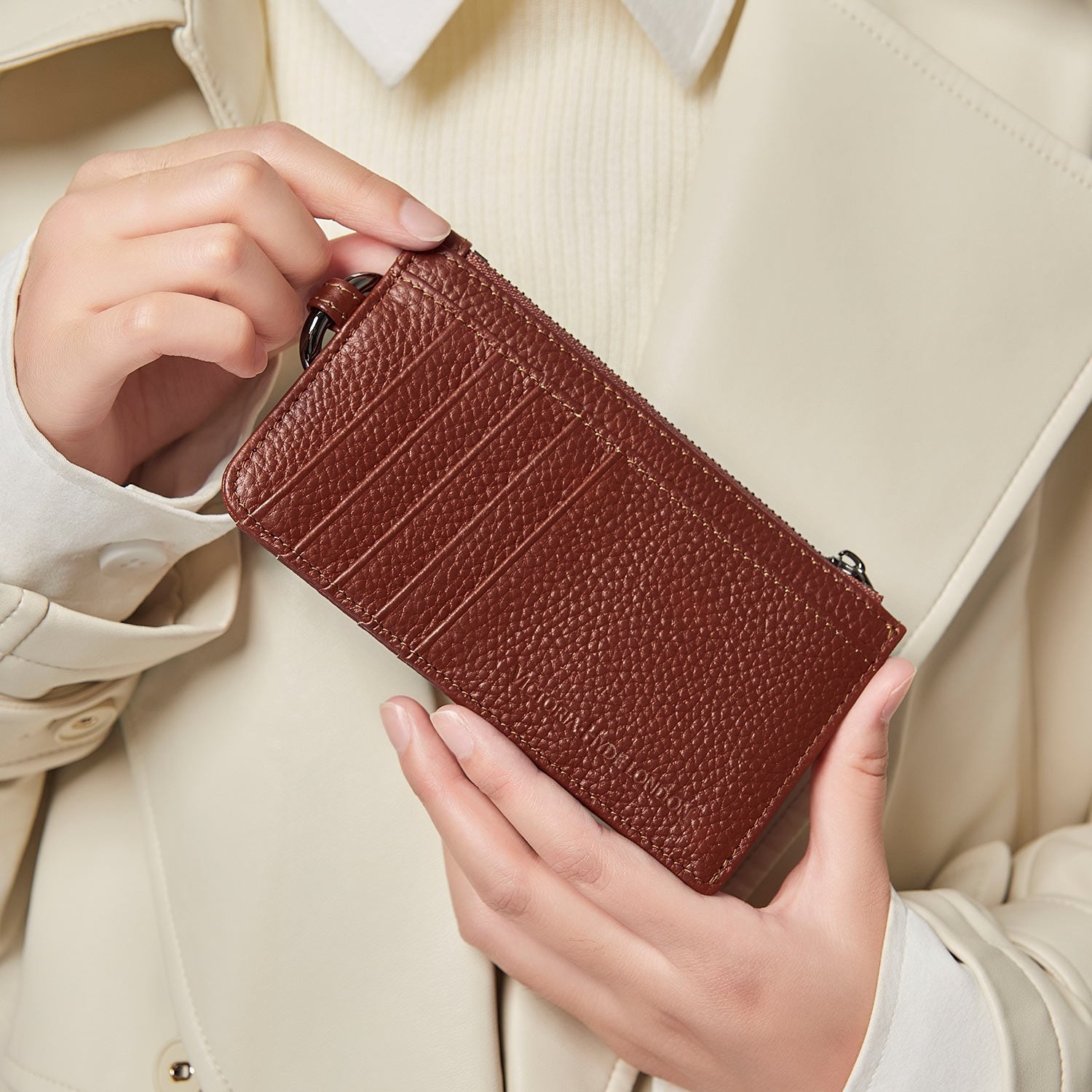 Victoria Hyde caramel genuine leather card holder, unisex &amp; multifunctional. Features 10 card slots, 1 ticket slot, zippered coin pocket, and detachable side closure.