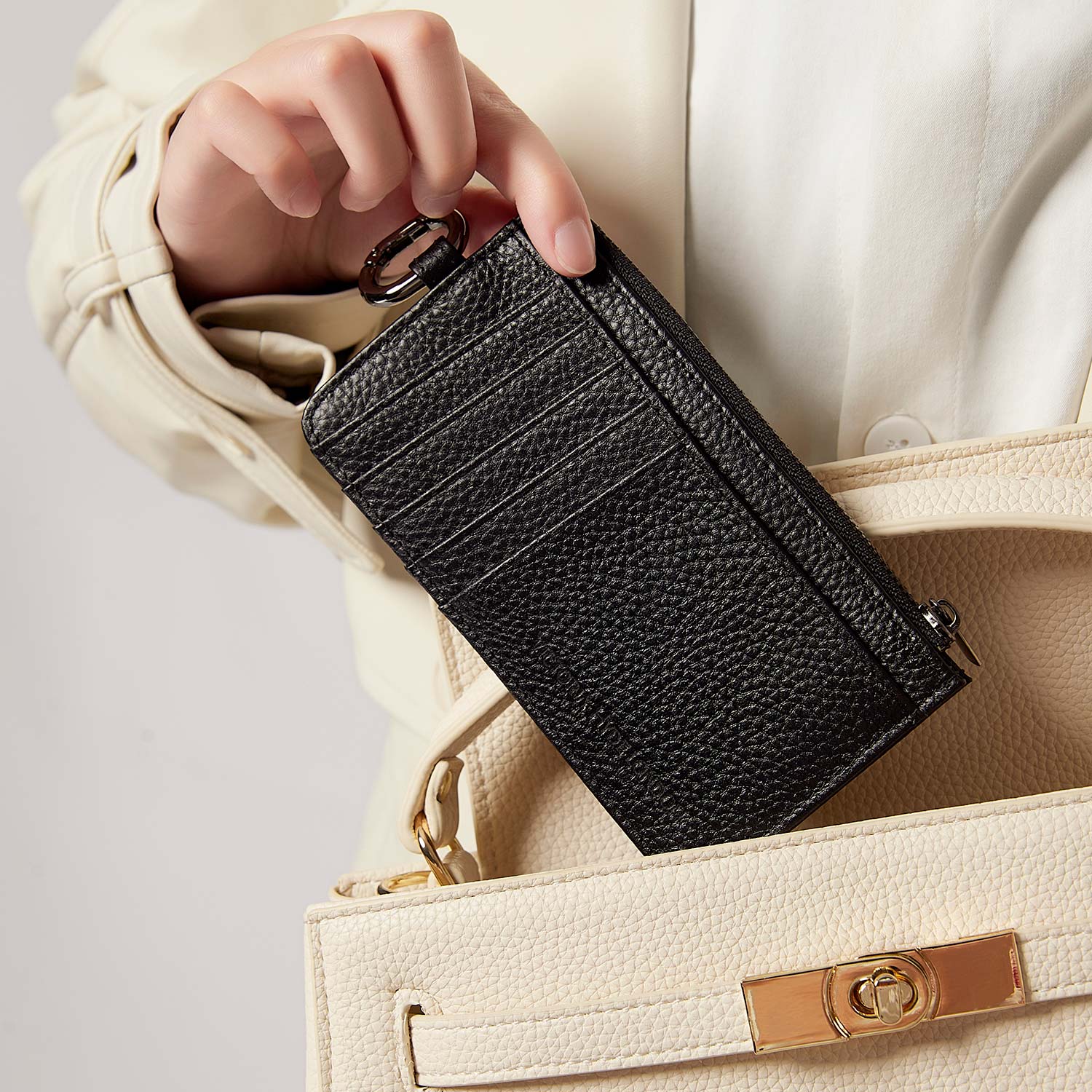 Victoria Hyde multifunctional genuine leather card holder in caramel color, unisex design with 10 card slots, ticket slot, coin pocket, and detachable closure.
