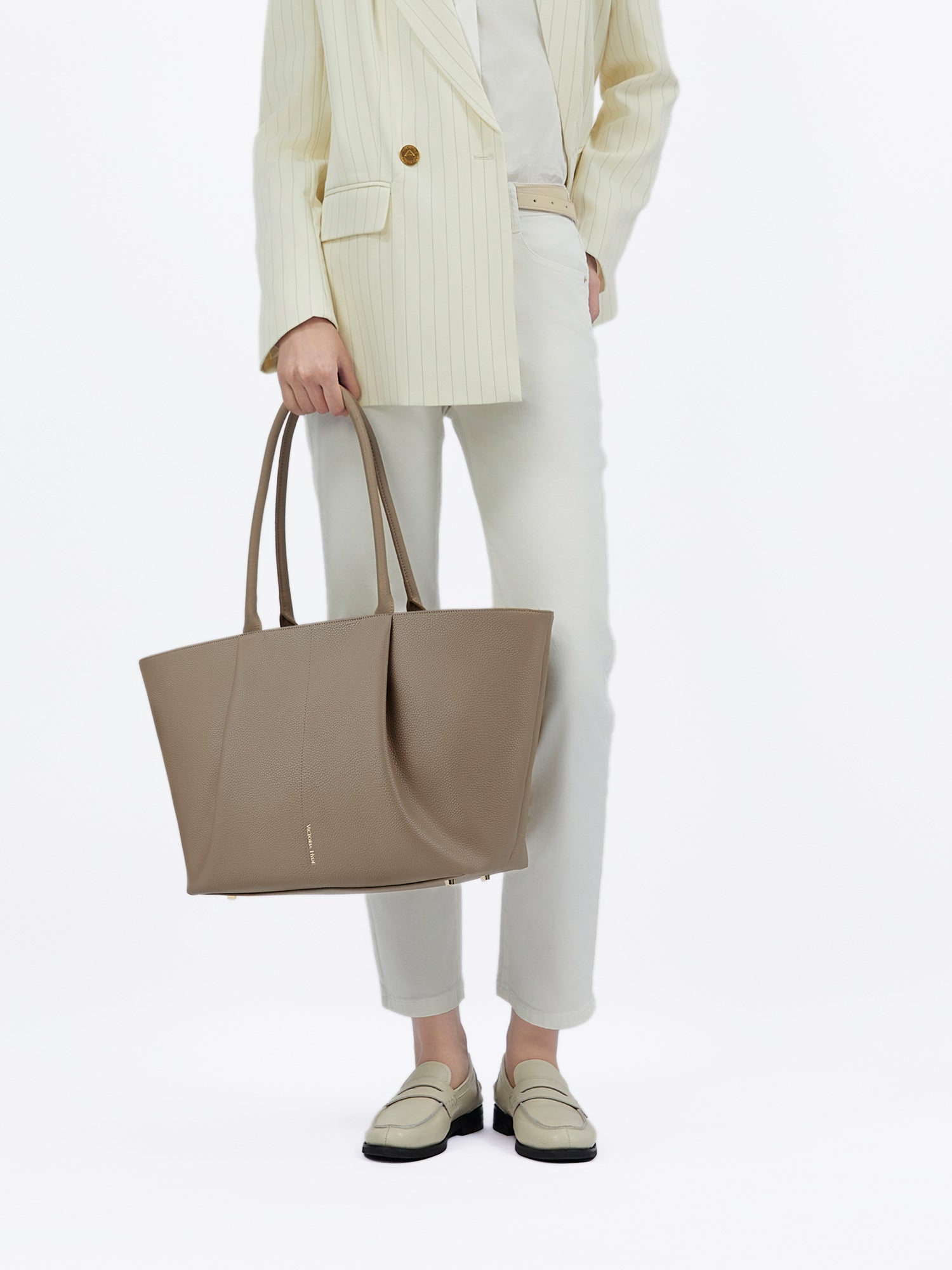 Victoria Hyde Ada Beige new work bag – understated elegance, fits 16" laptop, vegan microfiber leather, water-repellent, perfect for commuters.