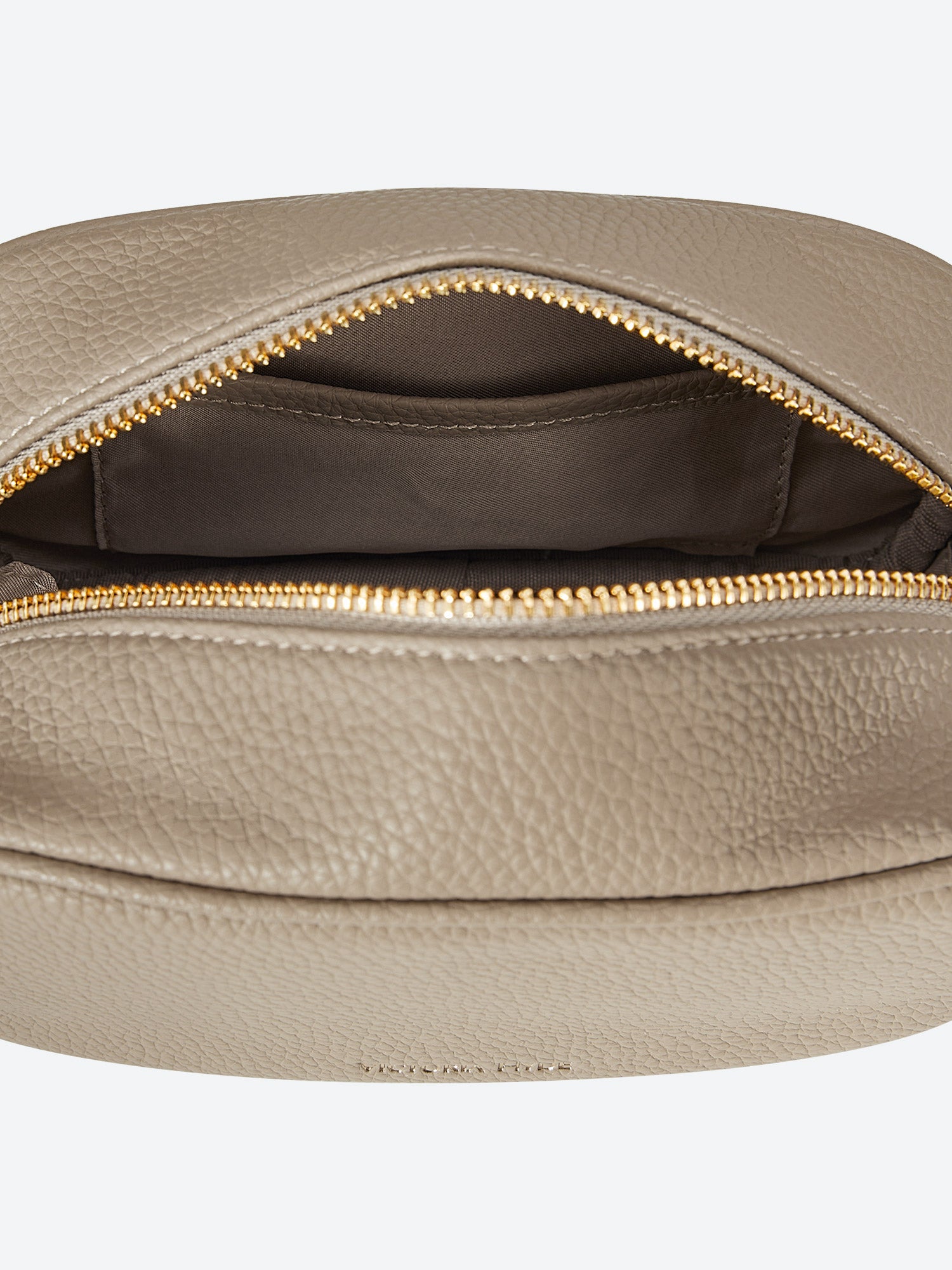 Victoria Hyde Antonia bag, light gold hardware, microfiber with recycled lining. Compact 18x10.5x9 cm, front pockets for keys, lipstick, earphones, slogan "Love what you do."
