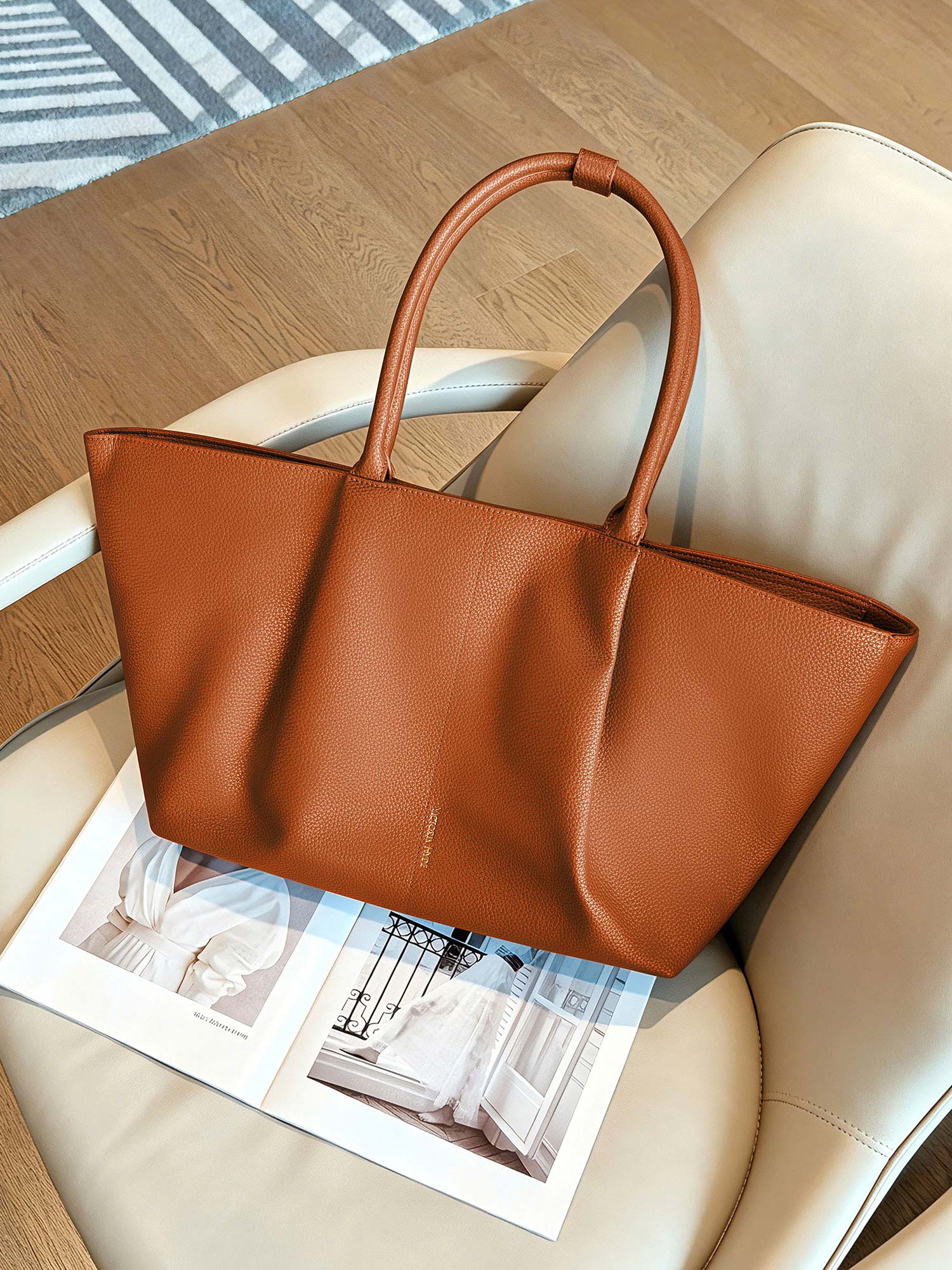 Victoria Hyde Ada laptop handbag in brown, stylish vegan leather business bag for women, featuring a padded compartment for up to 16-inch laptops.