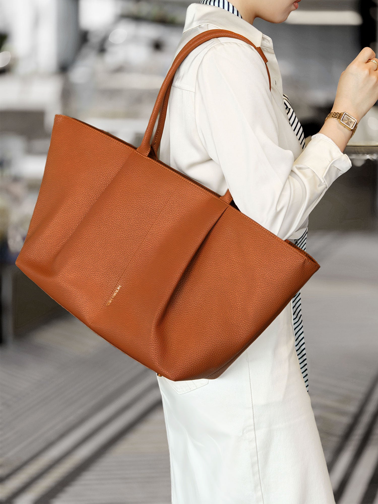 Victoria Hyde Ada laptop handbag in brown, stylish vegan leather business bag for women, featuring a padded compartment for up to 16-inch laptops.