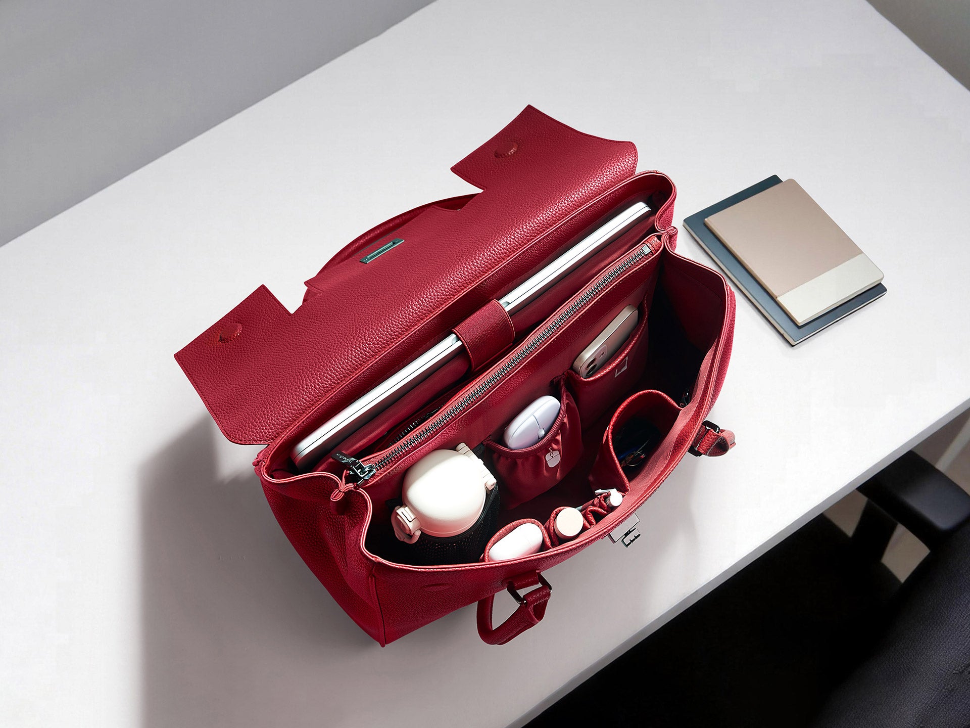 Red Victoria Hyde Jolene business bag with smart interior organization for laptop, water bottle, and office accessories.