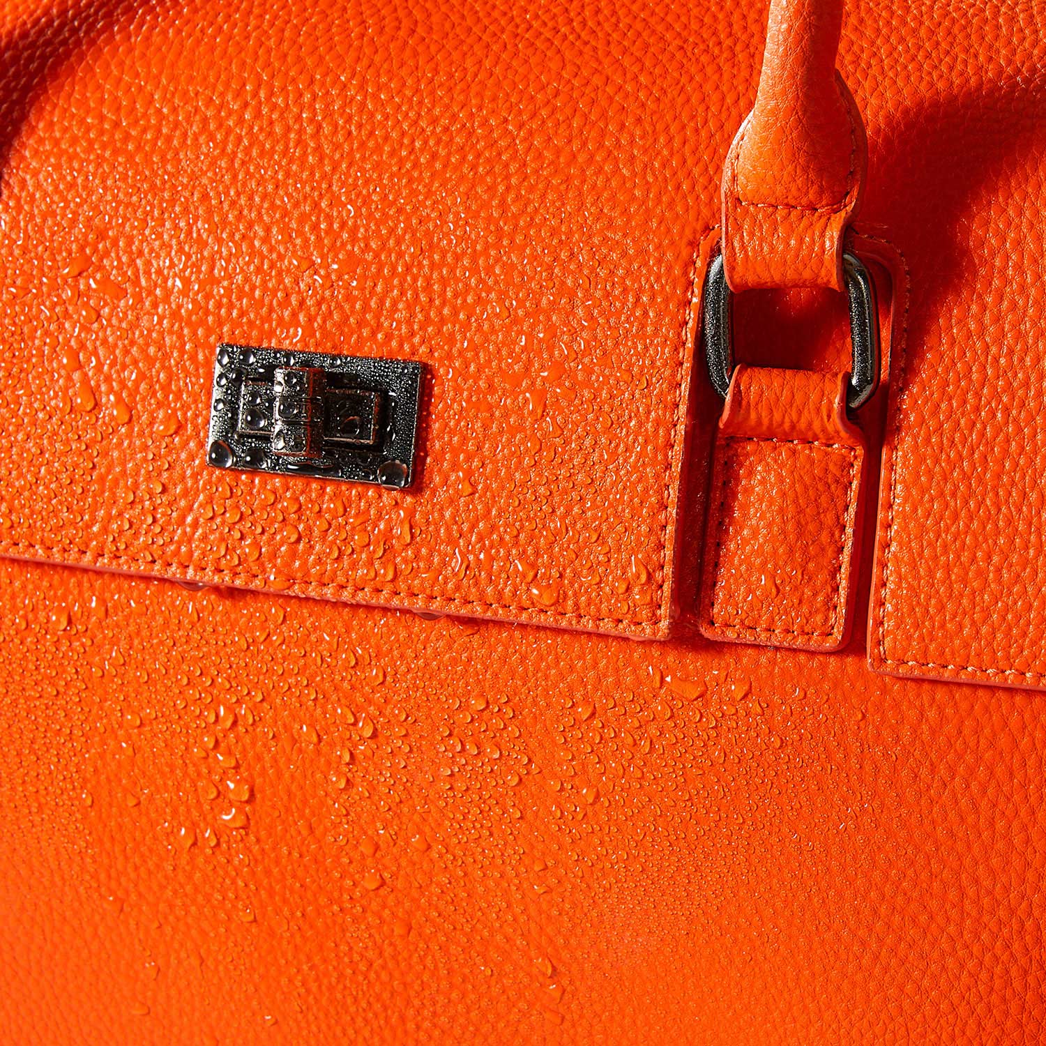 Victoria Hyde Jolene business bag in orange: High-quality, water-repellent vegan microfiber leather for durable protection in everyday use.