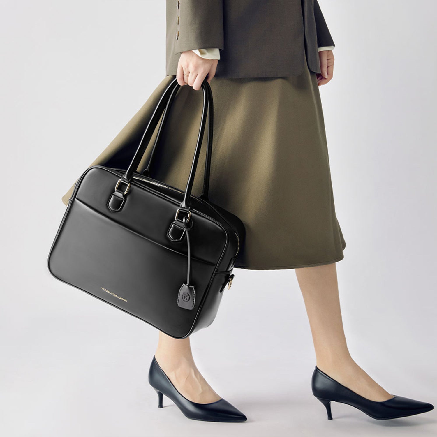 Victoria Hyde Margaret large black work bag with 13" laptop compartment, removable cosmetic pouch, vegan, water-repellent, smart interior.